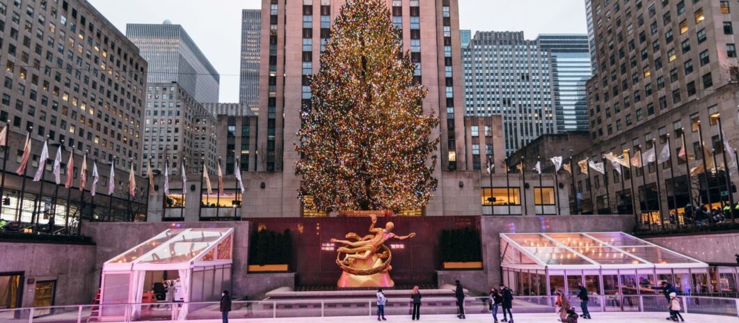 Rockefeller Center Christmas tree with ice skaters below.