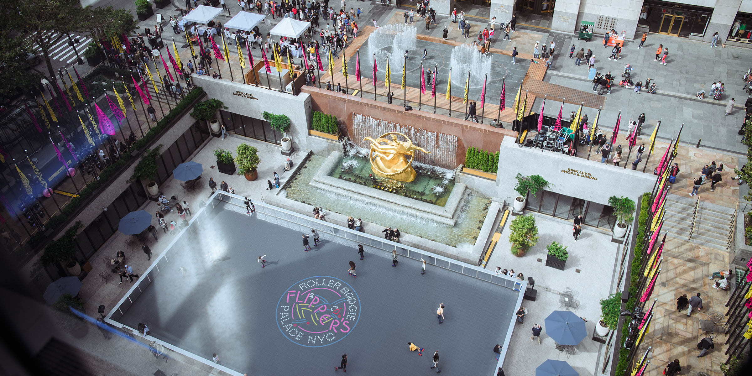 Rockefeller Center with golden statue and roller skating rink.