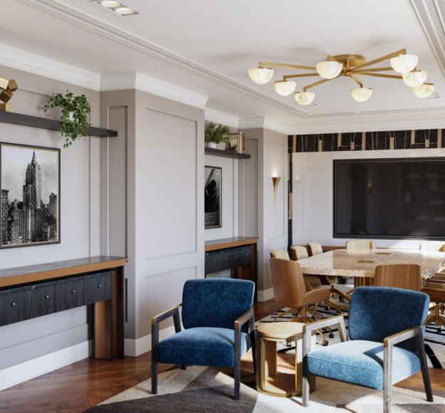 Hotel venue with a seating area featuring blue chairs and a TV.