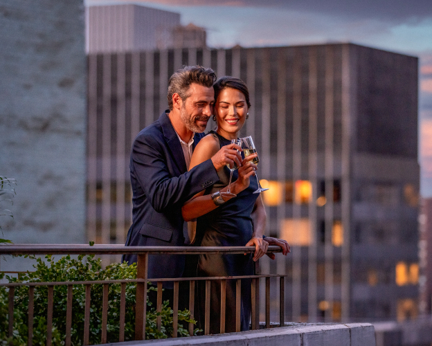 A couple embracing on the terrace.