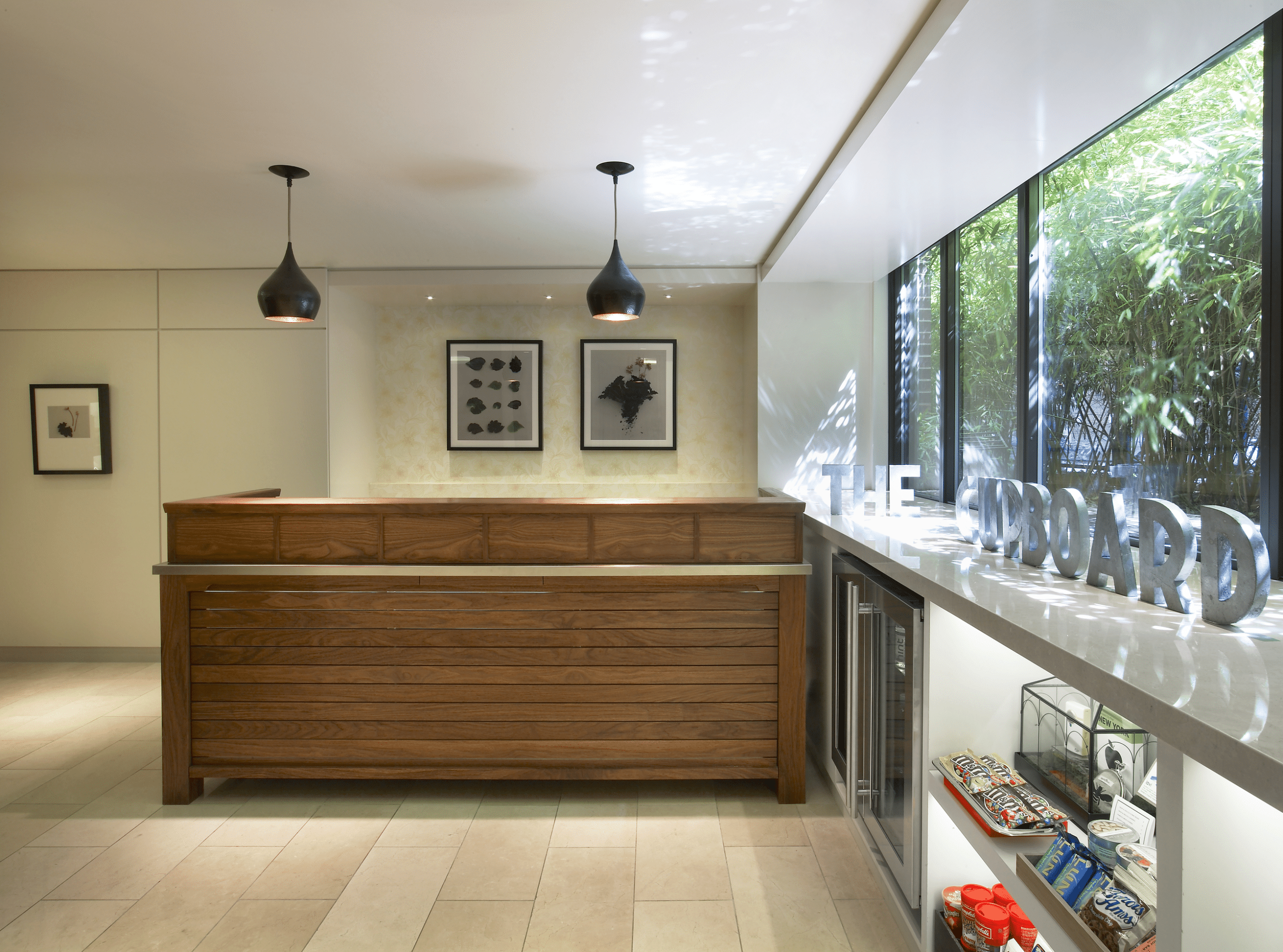 Hotel reception desk with wooden accents and modern decor.