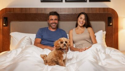 The Benjamin New York Lifestyle Image - Couple With Dog In Bed