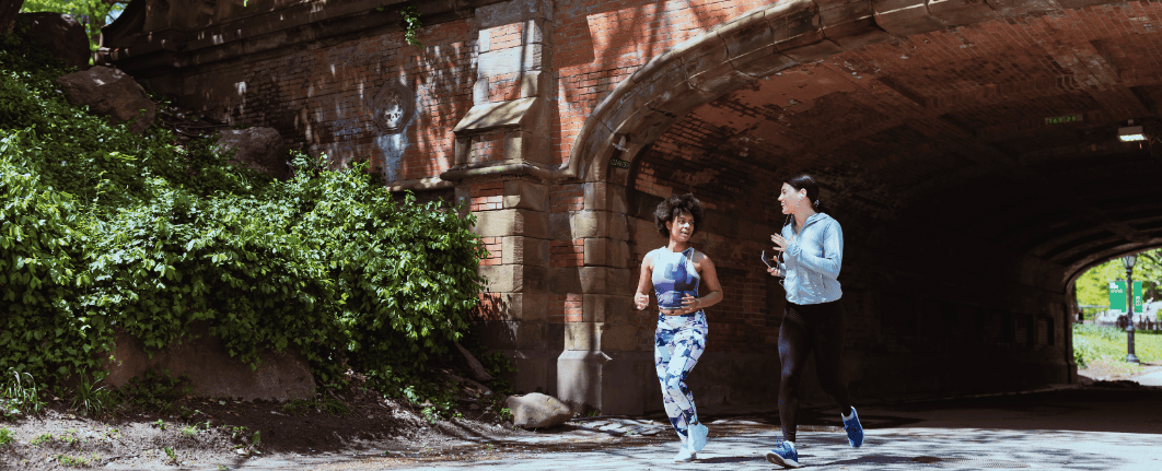 two people running in central park nyc